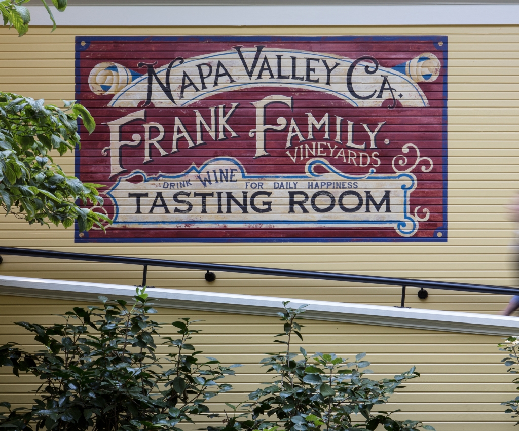 Handpainted Frank Family Vineyards sign on side of building