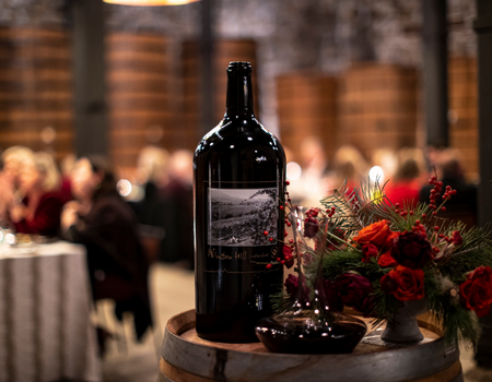A 9L bottle of 2011 Winston Hill in front of seated guests