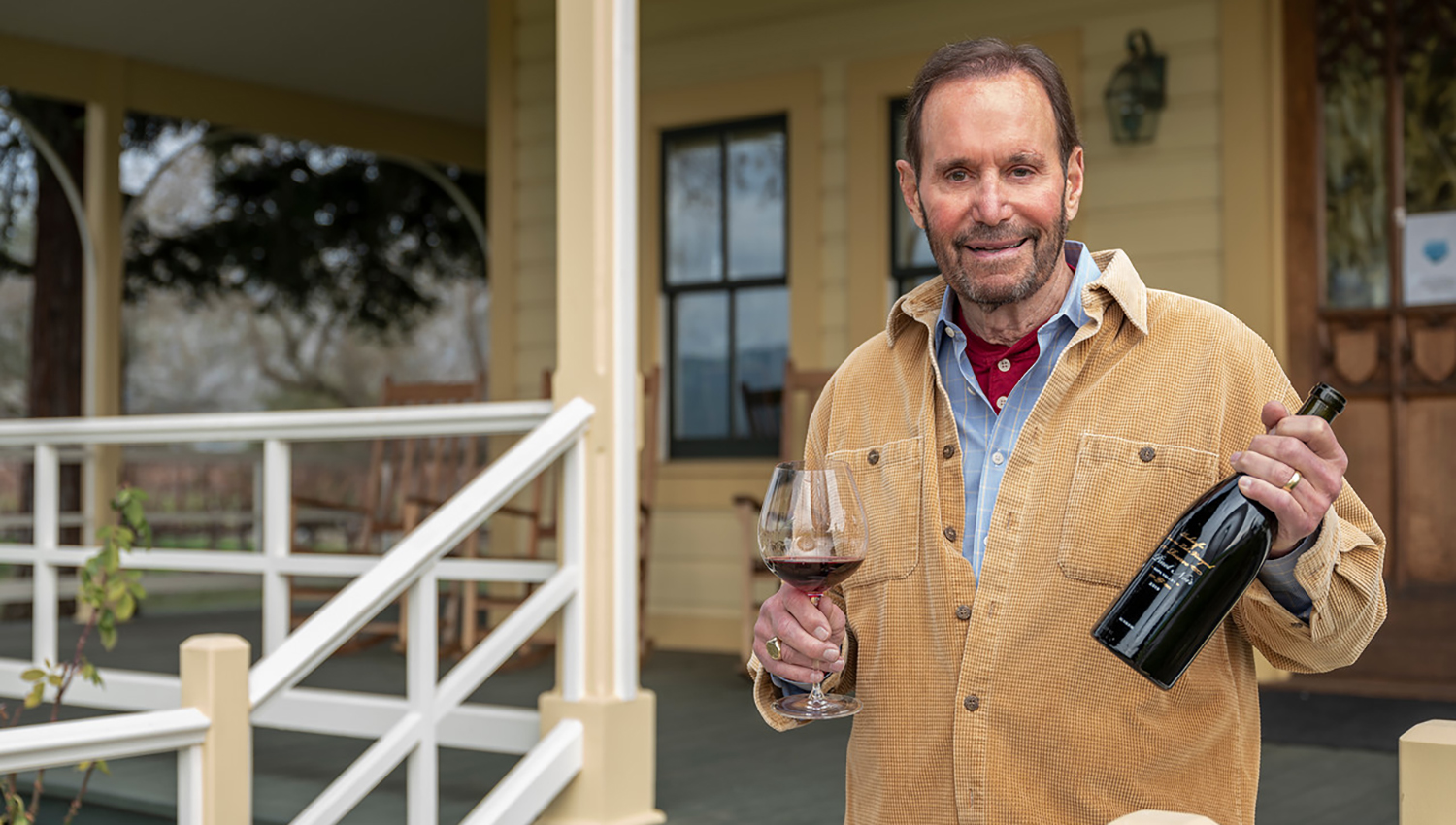 Andy Beckstoffer holding a bottle of wine