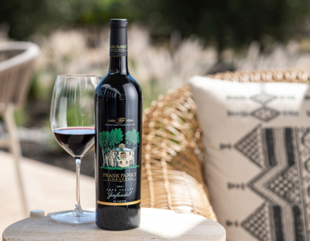 A bottle of Napa Valley Zinfandel on an outdoor patio table