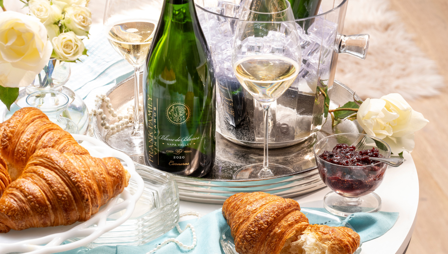 Frank Family Blanc de Blancs with a croissant.