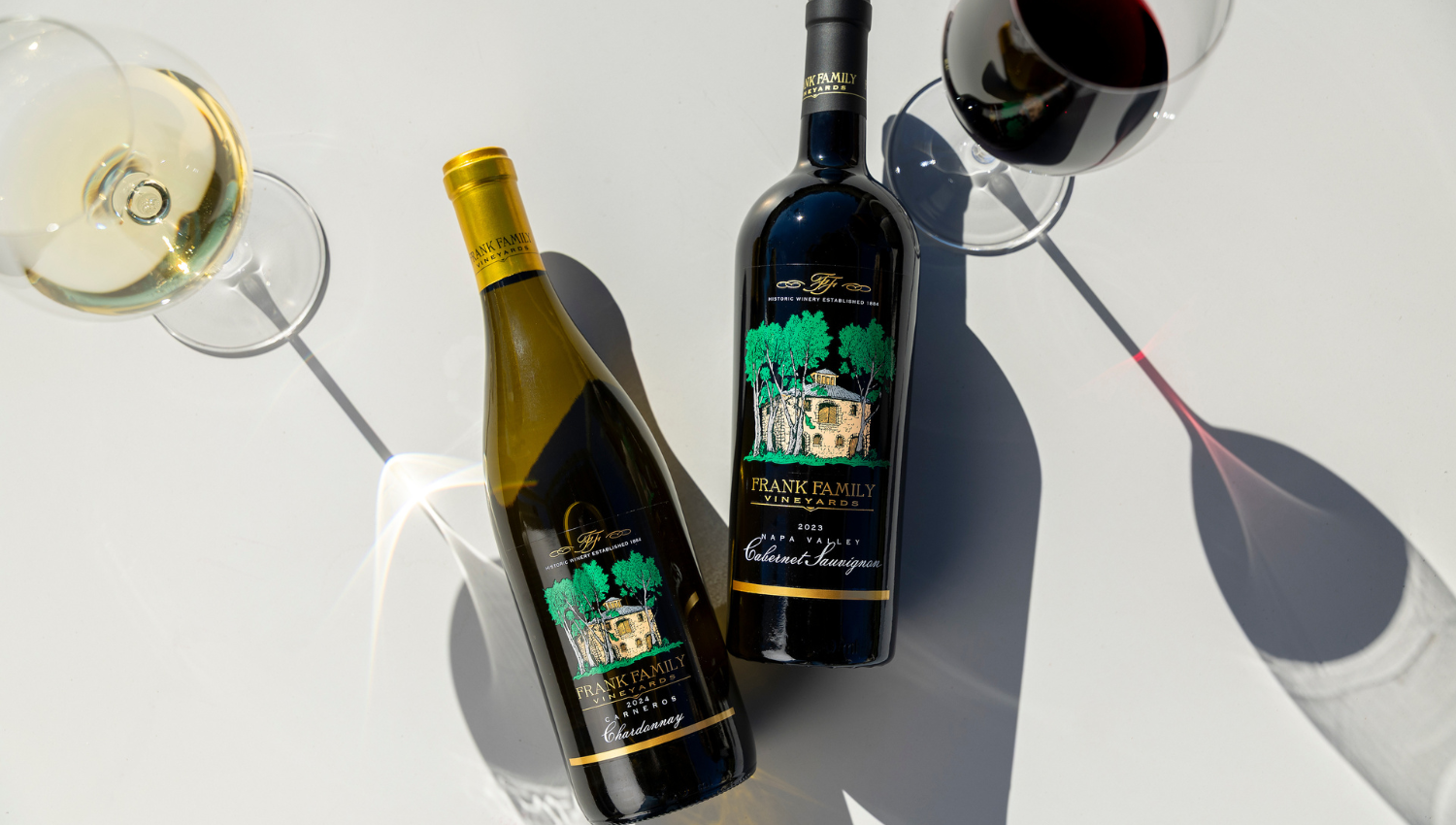 An overhead shot of a bottle of Chardonnay and Cabernet.