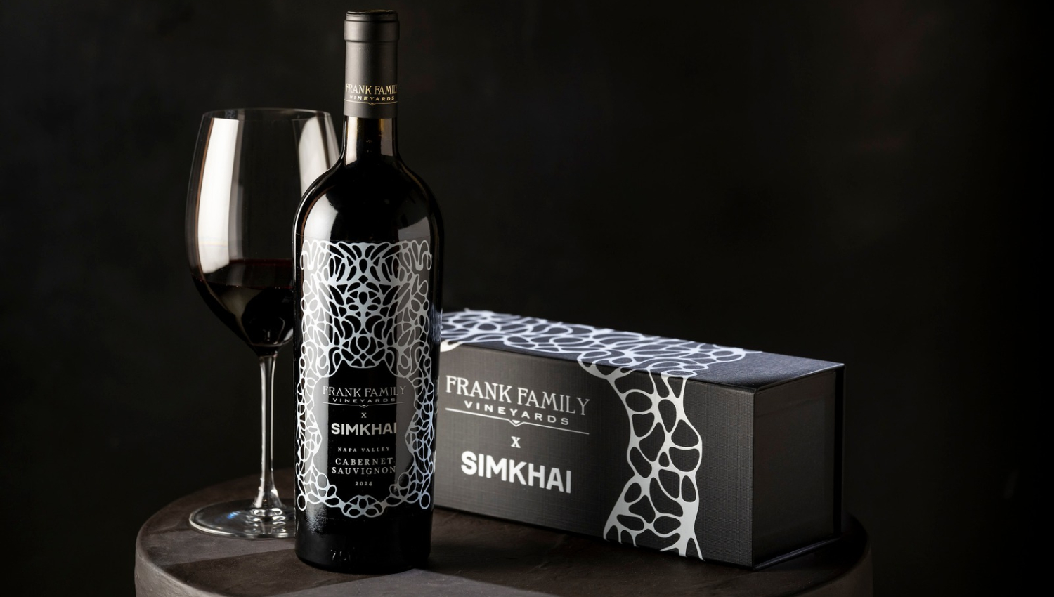 Frank Family Vineyards x SIMKHAI Custom Cabernet bottle and gift box on a black background