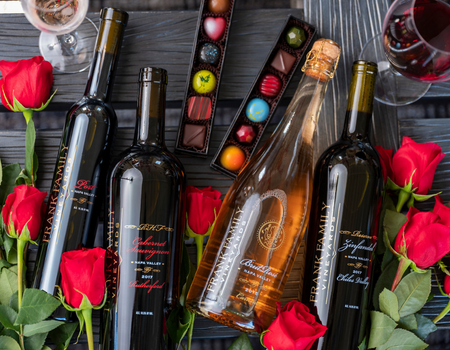 Box of artisanal chocolate with Frank Family wines and roses